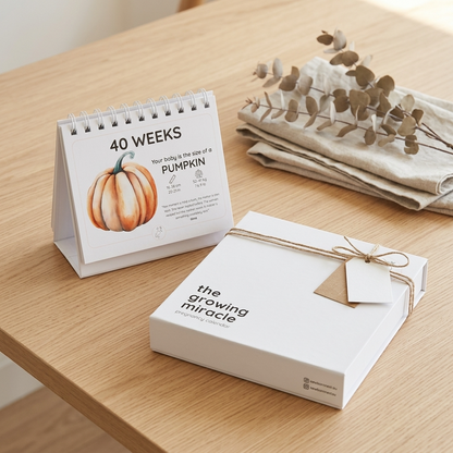 Calendar and book on a wooden surface with a pumpkin illustration
